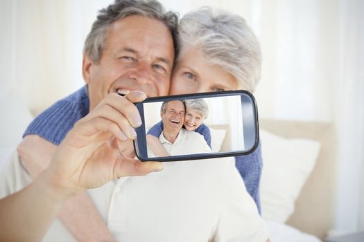 Composite of Couple taking selfie on smartphone