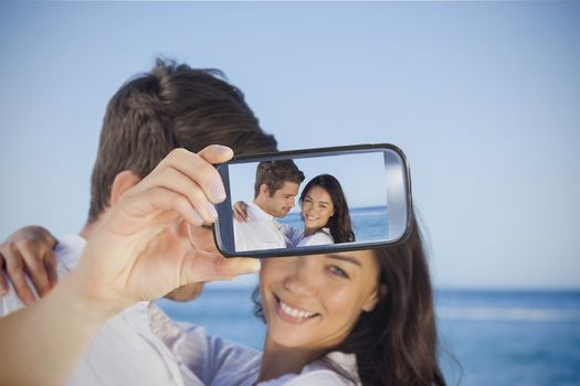 Composite of Couple taking selfie on smartphone