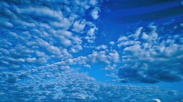 Blue sky and multiple clouds background