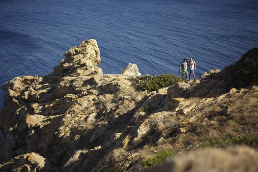 Capo Ferrato in Sardinia Landscape with people in excurion on the rocks