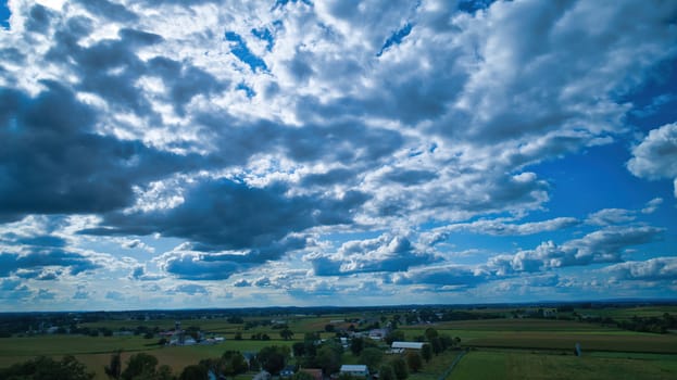 Blue sky and multiple clouds background showing a horizon