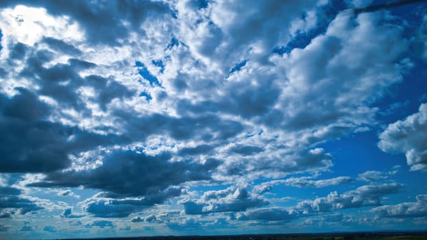Blue sky and multiple clouds background