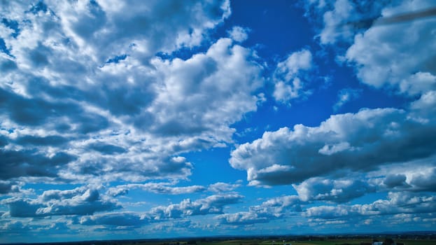Blue sky and multiple clouds background