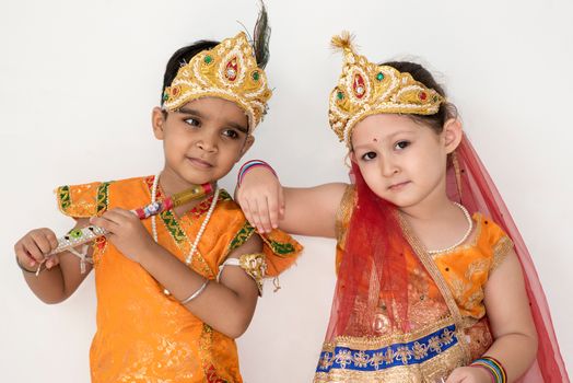 Children dress as Hindu deity Krishna and his consort Radha during the Janmashtami festival.