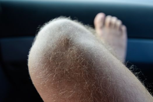Male hairy knee. hair on his feet.