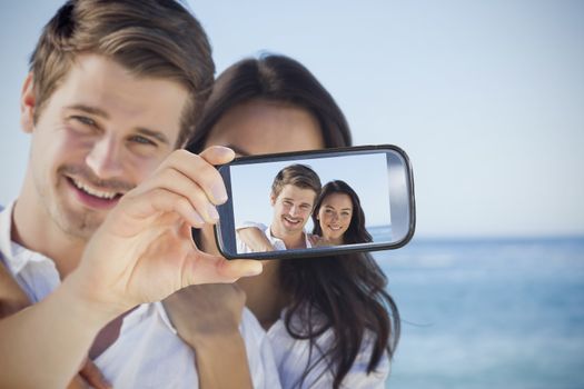 Composite of Couple taking selfie on smartphone