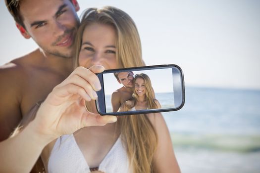 Composite of Couple taking selfie on smartphone