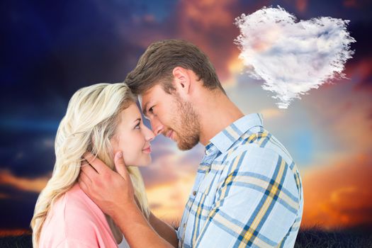 Attractive couple smiling at each other against cloud heart