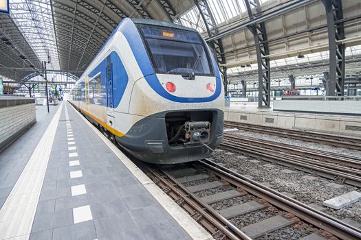 Train ready for departure on an empty central station in Amsterdam Netherlands during the corona crisis