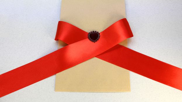 Red ribbon and heart for Valentine's day, for international women's day, for mother's day, love, Kraft paper, postcard
