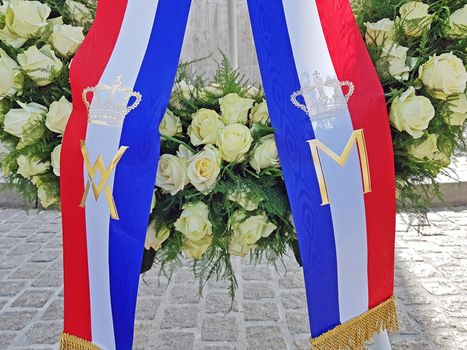 Amsterdam, Netherlands - May 4, 2020: Wreath laying at the National Monument on the Dam by the king and the queen from the Netherlands