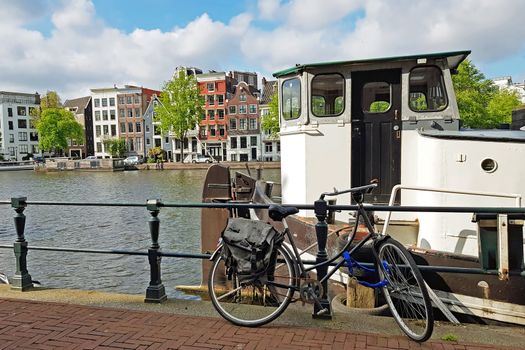 City scenic from Amsterdam at the river Amstel in the Netherlands