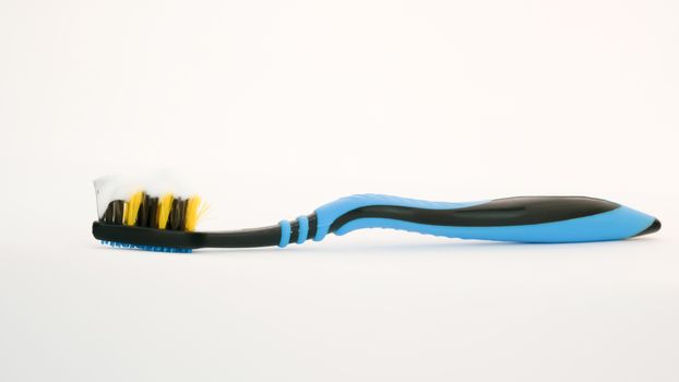 Toothbrush with villi paste on white background