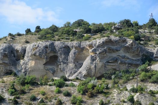 Limestone cliffs with a sample of material, limestone erosion in the rocks.