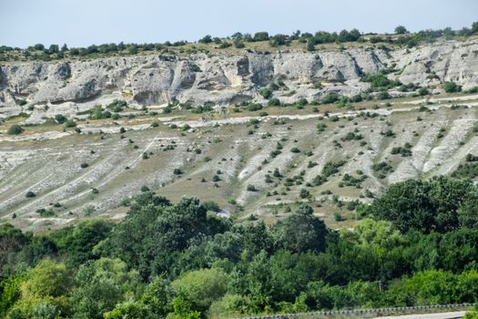 Limestone cliffs with a sample of material, limestone erosion in the rocks.