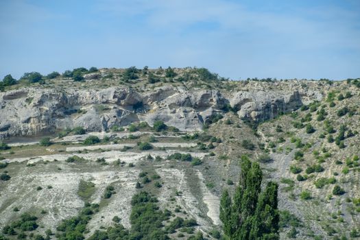 Limestone cliffs with a sample of material, limestone erosion in the rocks.