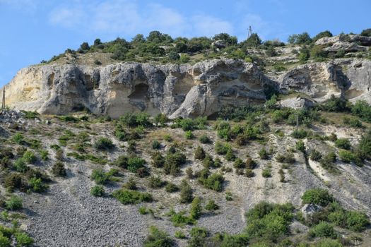 Limestone cliffs with a sample of material, limestone erosion in the rocks.