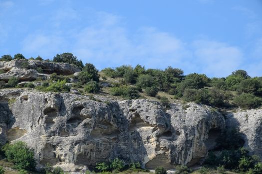 Limestone cliffs with a sample of material, limestone erosion in the rocks.