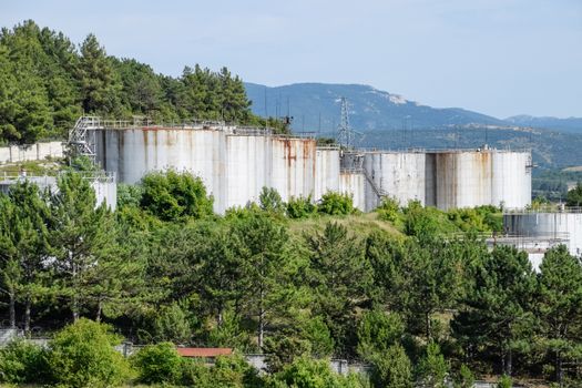 Oil storage tanks at the oil depot. reservoir vertical steel.