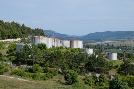 Oil storage tanks at the oil depot. reservoir vertical steel.