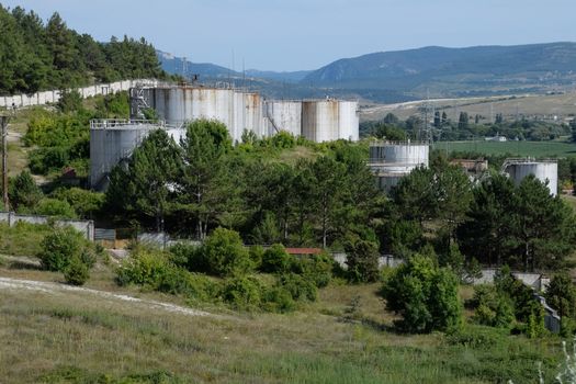 Oil storage tanks at the oil depot. reservoir vertical steel.