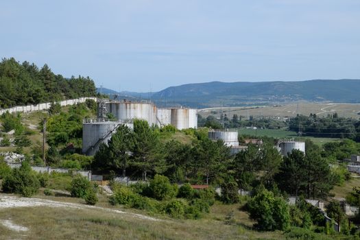 Oil storage tanks at the oil depot. reservoir vertical steel.