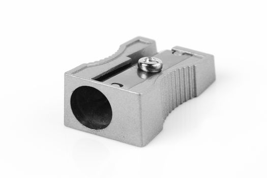 A pencil sharpener on white with shadow and selective focus