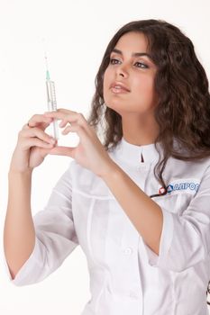 Young woman in the medical uniform on isolated background