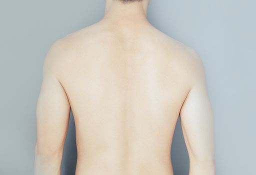 Closeup back of man on grey background beauty healthy skin care concept