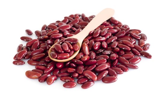 Red kidney beans in wood spoon isolated on white background, healthy food concept