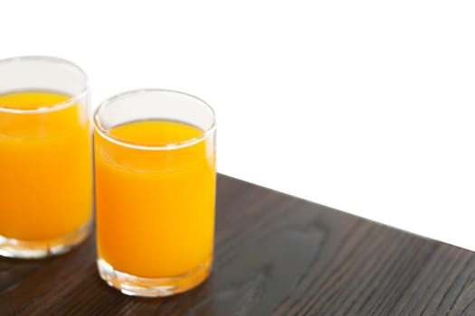 Closeup orange juice on wood table, drink for healthy concept, selective focus