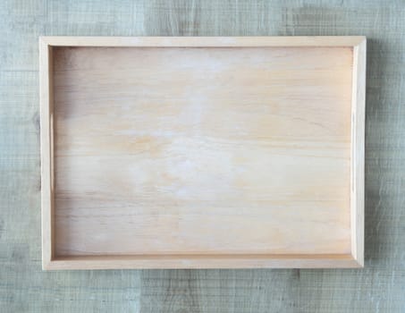 Empty wooden tray on wood table background, Top view