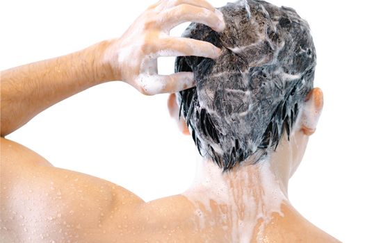 Closeup young man washing hair with shampoo isoleted on white background