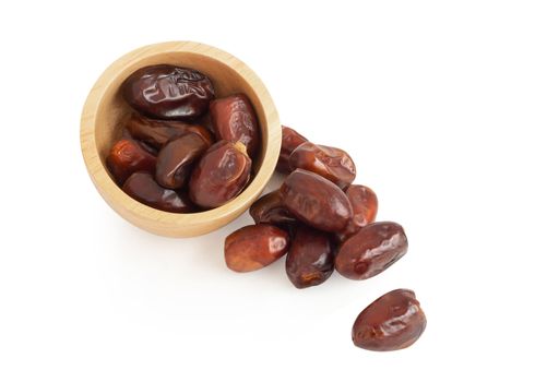 Date palm in wooden bowl isolated on white blackground, Food healthy concept
