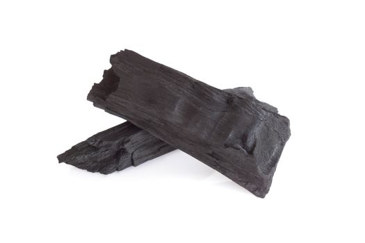 Natural black charcoal isolated on white background