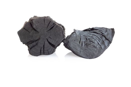 Natural black charcoal isolated on white background