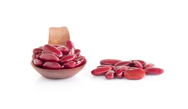Red kidney beans in wood spoon isolated on white background, healthy food concept