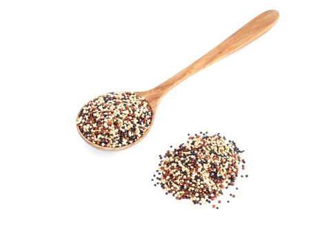 Quinoa in wooden spoon isolated on white background, health care concept