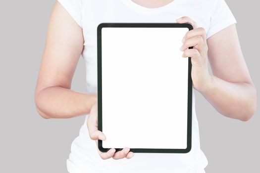 Close up woman hand holding digital tablet computer with white screen for text or product advertising concept