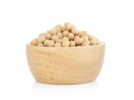Soybean in wooden bowl isolated on white background, healthy food concept