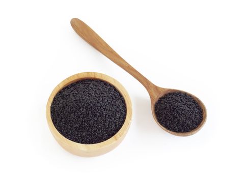 Top view black sesame seeds in wooden bowl on white background, healthy food concept