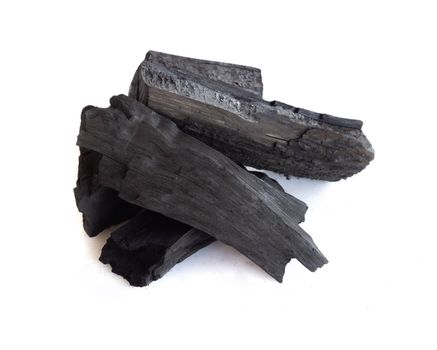 Natural black charcoal isolated on white background