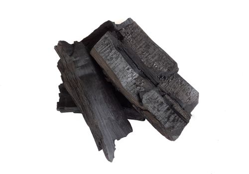 Natural black charcoal isolated on white background