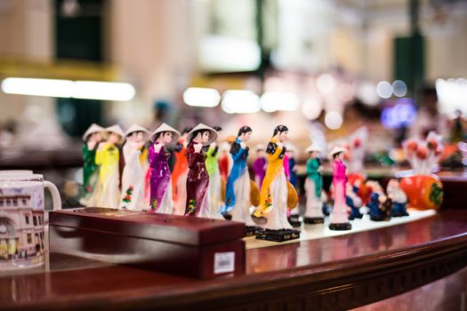 Dolls wearing Ao dai, which are on sale for tourists at Saigon Central Post Office.