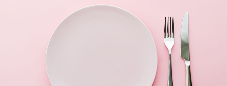 Empty plate and cutlery as mockup set on pink background, top tableware for chef table decor and menu branding design