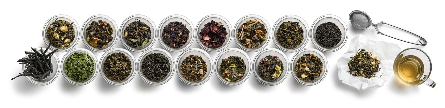 Large assortment of tea on a white background. The view from the top.