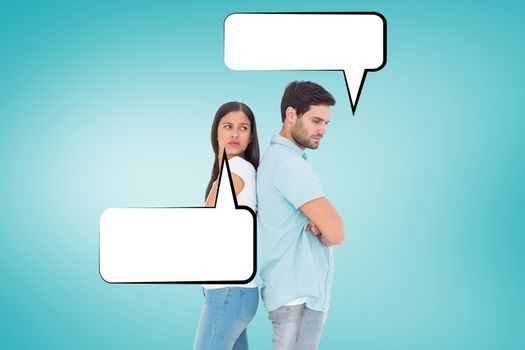 Unhappy couple not speaking to each other  against blue vignette background