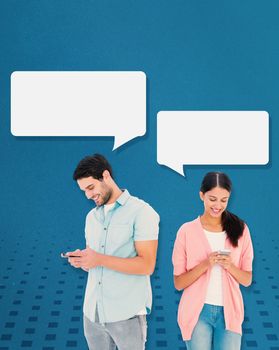 Happy couple sending text messages against blue