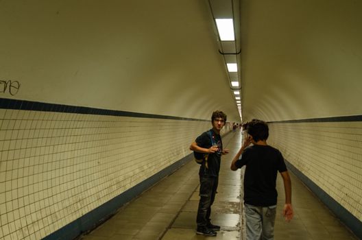 Antwerp, Flanders, Belgium. August 2019. The long underground tunnel, called Annatunnel, which passes under the Scheldt river. People walk it on foot or by bike.