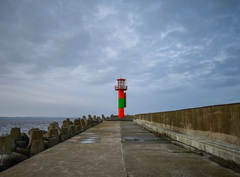 Colorful lantern at end of the breakwater in Swinoujscie city